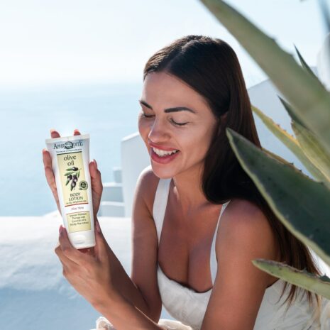 Aphrodite Body Lotion with Aloe Vera in hand